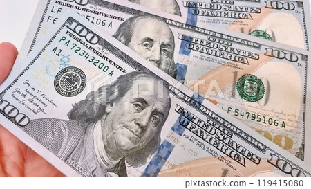 A Fan of $100 Bills.A close-up photo of a fan of $100 US dollar bills. The bills are arranged neatly, with the portrait of Benjamin Franklin visible on each bill. A Fan of $100 Bills.A close-up photo of a fan of $100 US dollar bills. The bills are arranged neatly, with the portrait of Benjamin Franklin visible on each bill. 119415080