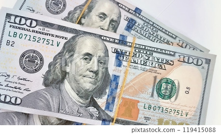 A Fan of $100 Bills.A close-up photo of a fan of $100 US dollar bills. The bills are arranged neatly, with the portrait of Benjamin Franklin visible on each bill. A Fan of $100 Bills.A close-up photo of a fan of $100 US dollar bills. The bills are arranged neatly, with the portrait of Benjamin Franklin visible on each bill. 119415088