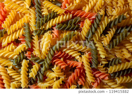 Uncooked Vibrant Colored Fusilli Pasta Background 119415882