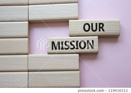 Our Mission symbol. Concept word Our Mission on wooden blocks. Beautiful pink background. Business and Our Mission concept. Copy space 119416312