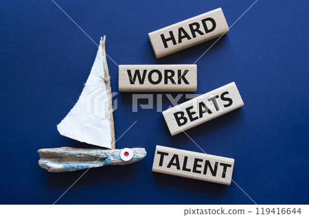 Talent symbol. Concept words Hard work beats talent on wooden blocks. Beautiful deep blue background with boat. Business and Hard work beats talent concept. Copy space Talent symbol. Concept words Hard work beats talent on wooden blocks. Beautiful deep blue background with boat. Business and Hard work beats talent concept. Copy space 119416644
