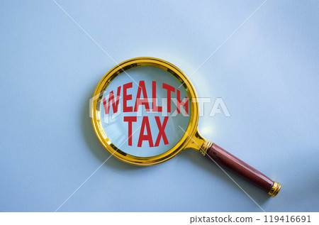 Wealth Tax symbol. Magnifying glass with words Wealth Tax. Beautiful blue background. Business and Wealth Tax concept. Copy space. Wealth Tax symbol. Magnifying glass with words Wealth Tax. Beautiful blue background. Business and Wealth Tax concept. Copy space. 119416691