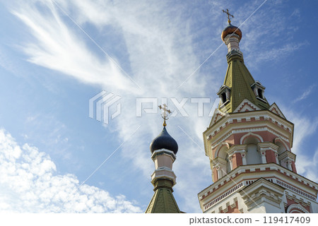 Russian Christian Orthodox church with domes and a cross against the sky. Russian Orthodoxy and Christian Faith concept. Russian Christian Orthodox church with domes and a cross against the sky. Russian Orthodoxy and Christian Faith concept. 119417409