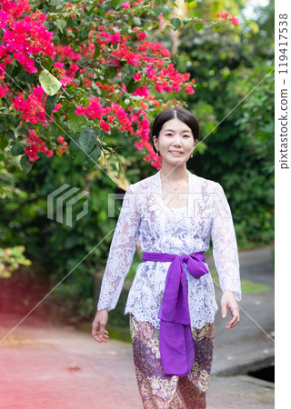 A Japanese woman wearing Balinese traditional dress (Kebaya) A Japanese woman wearing Balinese traditional dress (Kebaya) 119417538