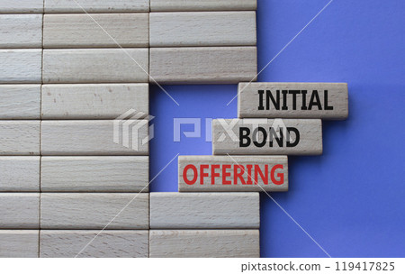Initial Bond Offering symbol. Concept words Initial Bond Offering on wooden blocks. Beautiful purple background. Business and Initial Bond Offering concept. Copy space 119417825