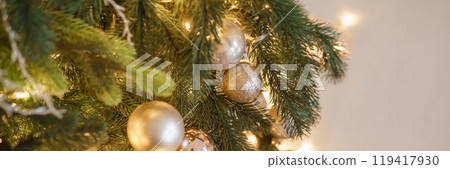Christmas balls in close-up on the Christmas tree. Decorations for Christmas trees. The concept of celebrating New Year and Christmas 119417930