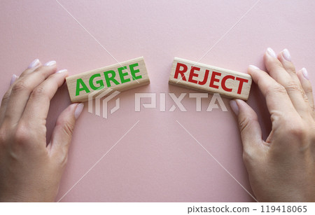 Agree or Reject symbol. Concept word Agree or Reject on wooden blocks. Businessman hand. Beautiful pink background. Gender and Agree or Reject concept. Copy space Agree or Reject symbol. Concept word Agree or Reject on wooden blocks. Businessman hand. Beautiful pink background. Gender and Agree or Reject concept. Copy space 119418065
