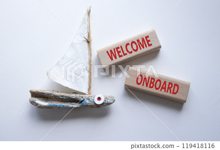 Welcome onboard symbol. Concept words Welcome onboard on wooden blocks. Beautiful white background with boat. Business and Welcome onboard concept. Copy space. Welcome onboard symbol. Concept words Welcome onboard on wooden blocks. Beautiful white background with boat. Business and Welcome onboard concept. Copy space. 119418116