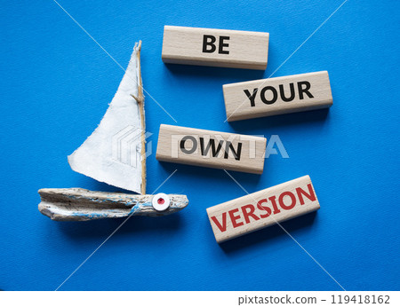 Be your own version symbol. Concept words Be your own version on wooden blocks. Beautiful blue background with boat. Business and Be your own version concept. Copy space Be your own version symbol. Concept words Be your own version on wooden blocks. Beautiful blue background with boat. Business and Be your own version concept. Copy space 119418162