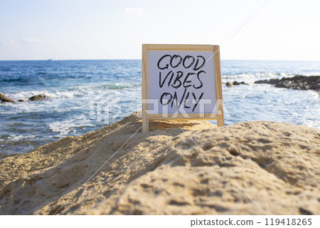 Good Vibes only symbol. White Blackboard with Concept words Good Vibes only. Beautiful sea background. Business and Good Vibes only concept. Copy space. Good Vibes only symbol. White Blackboard with Concept words Good Vibes only. Beautiful sea background. Business and Good Vibes only concept. Copy space. 119418265