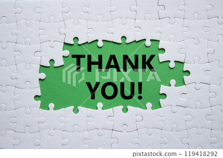 Thank you symbol. White puzzle with words Thank you. Beautiful green background. Business and Thank you concept. Copy space. 119418292