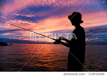 Man fishing in the sea 119418408