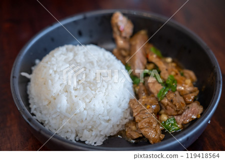 Rice with Kaprao beef served on plate. It is Thai style stir-fried holy basil with meat. Rice with Kaprao beef served on plate. It is Thai style stir-fried holy basil with meat. 119418564