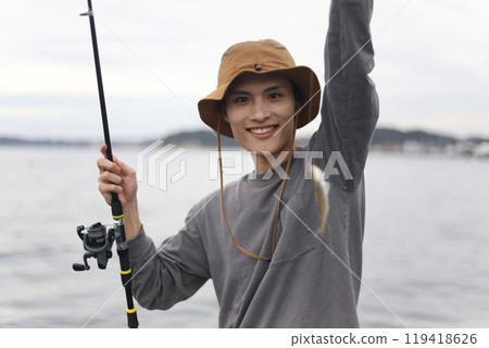 Man fishing in the sea 119418626