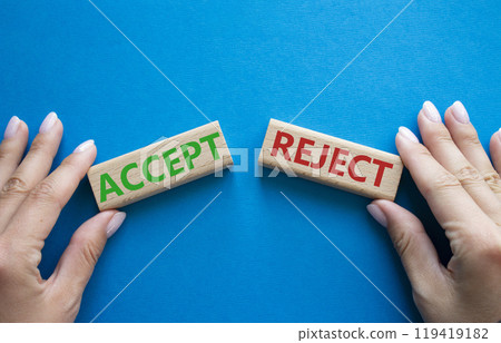 Accept or Reject symbol. Concept word Accept or Reject on wooden blocks. Businessman hand. Beautiful blue background. Business and Accept or Reject concept. Copy space Accept or Reject symbol. Concept word Accept or Reject on wooden blocks. Businessman hand. Beautiful blue background. Business and Accept or Reject concept. Copy space 119419182