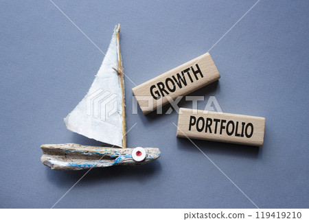 Growth Portfolio symbol. Concept word Growth Portfolio on wooden blocks. Beautiful grey background with boat. Business and Growth Portfolio concept. Copy space 119419210