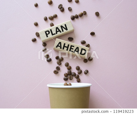 Plan ahead symbol. Wooden blocks with words Plan ahead. Beautiful pink background with coffee cup and coffee beans. Business and Plan ahead concept. Copy space. 119419223