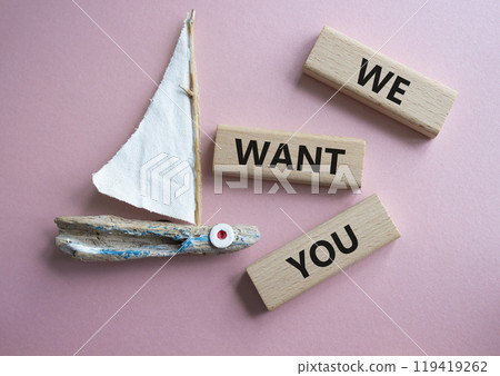 We want you symbol. Concept words We want you on wooden blocks. Beautiful pink background with boat. Business and We want you concept. Copy space. 119419262