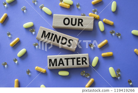 Our Minds Matter symbol. Concept words Our Minds Matter on wooden blocks. Beautiful purple background with pills. Healthcare and Our Minds Matter concept. Copy space. Our Minds Matter symbol. Concept words Our Minds Matter on wooden blocks. Beautiful purple background with pills. Healthcare and Our Minds Matter concept. Copy space. 119419266