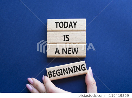 Today is a new beginning symbol. Wooden blocks with words Today is a new beginning. Beautiful deep blue background. Businessman hand. Business and Today is a new beginning concept. Copy space. 119419269