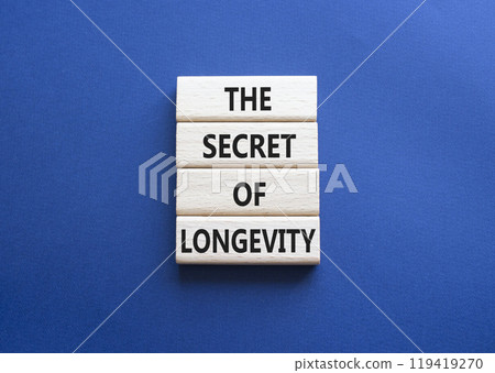 The Secret of Longevity symbol. Wooden blocks with words The Secret of Longevity. Beautiful deep blue background. Business and The Secret of Longevity concept. Copy space. 119419270
