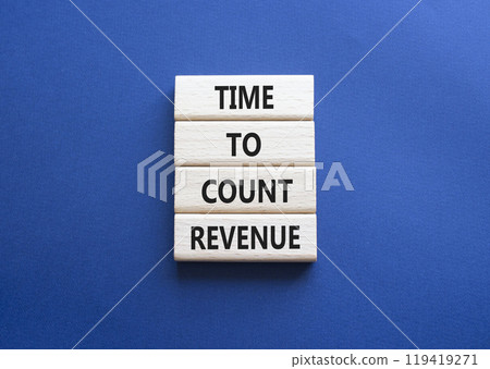 Time to count Revenue symbol. Wooden blocks with words Time to count Revenue. Beautiful deep blue background. Business and Time to count Revenue concept. Copy space. 119419271