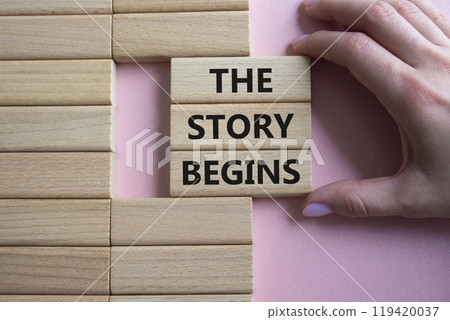 The Store Begins symbol. Concept words The Store Begins on wooden blocks. Businessman hand. Beautiful pink background. Business and The Store Begins concept. Copy space 119420037
