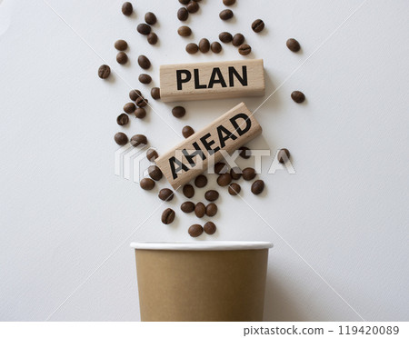 Plan ahead symbol. Wooden blocks with words Plan ahead. Beautiful white background with coffee cup and coffee beans. Business and Plan ahead concept. Copy space. 119420089