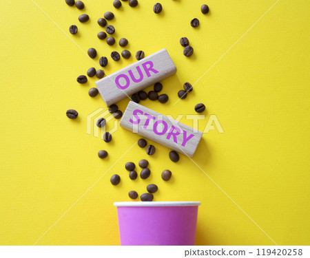 Our story symbol. Wooden blocks with words Our story Beautiful yellow background with coffee cup and coffee beans. Business and Our story concept. Copy space. 119420258