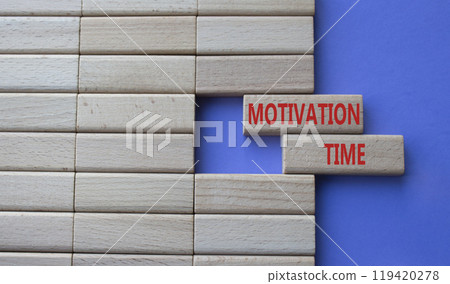 Motivation Time symbol. Concept word Motivation Time on wooden blocks. Beautiful purple background. Business and Motivation Time concept. Copy space 119420278