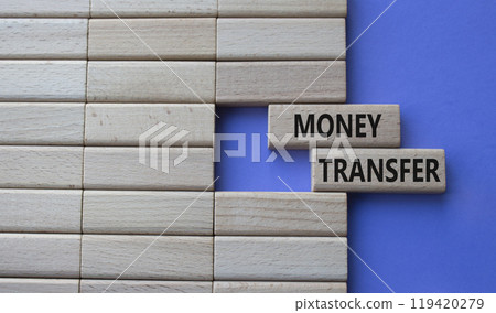 Money Transfer symbol. Concept word Money Transfer on wooden blocks. Beautiful purple background. Business and Money Transfer concept. Copy space Money Transfer symbol. Concept word Money Transfer on wooden blocks. Beautiful purple background. Business and Money Transfer concept. Copy space 119420279