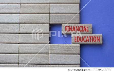 Financial Education symbol. Concept word Financial Education on wooden blocks. Beautiful purple background. Business and Financial Education concept. Copy space 119420280