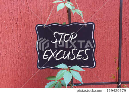 Stop excuses symbol. Concept word Stop excuses on chalk blackboard. Beautiful red background. Business and Stop excuses concept. Copy space 119420379