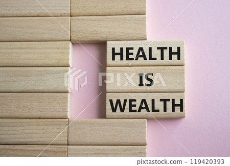 Health is Wealth symbol. Concept word Health is Wealth on wooden blocks. Beautiful pink background with boat. Medicine and Health is Wealth concept. Copy space 119420393
