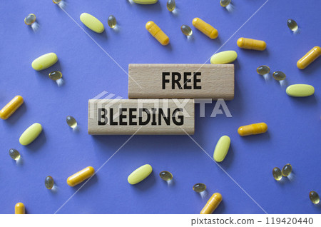 Free bleeding symbol. Concept words Free bleeding on wooden blocks. Beautiful purple background with pills. Motivational and Free bleeding concept. Copy space. Free bleeding symbol. Concept words Free bleeding on wooden blocks. Beautiful purple background with pills. Motivational and Free bleeding concept. Copy space. 119420440