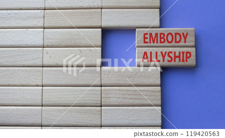 Embody Allyship symbol. Concept word Embody Allyship on wooden blocks. Beautiful purple background. Business and Embody Allyship concept. Copy space 119420563