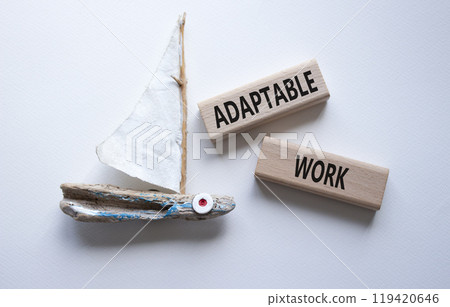 Adaptable work symbol. Concept word Adaptable work on wooden blocks. Beautiful white background with succulent boat. Business and Adaptable work concept. Copy space 119420646