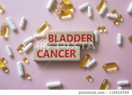 Bladder Cancer symbol. Concept word Bladder Cancer on wooden blocks. Beautiful pink background with pills. Medicine and Bladder Cancer concept. Copy space Bladder Cancer symbol. Concept word Bladder Cancer on wooden blocks. Beautiful pink background with pills. Medicine and Bladder Cancer concept. Copy space 119420769