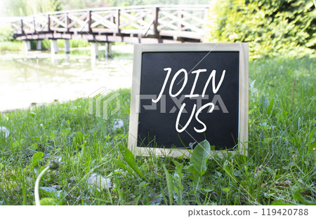 Join us symbol. Concept word Join us on black chalk background. Beautiful meadow background with bridge. Business and Join us concept. Copy space 119420788