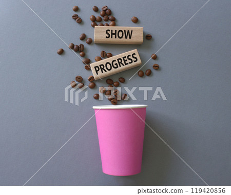 Progress symbol. Wooden blocks with words Show progress. Beautiful grey background with coffee cup and coffee beans. Business and Show progress concept. Copy space. Progress symbol. Wooden blocks with words Show progress. Beautiful grey background with coffee cup and coffee beans. Business and Show progress concept. Copy space. 119420856