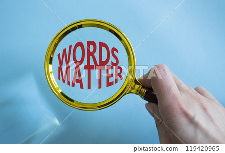 Words Matter symbol. Magnifying Glass with Concept word Words Matter. Businessman hand. Beautiful blue background. Business and Words Matter concept. Copy space Words Matter symbol. Magnifying Glass with Concept word Words Matter. Businessman hand. Beautiful blue background. Business and Words Matter concept. Copy space 119420965