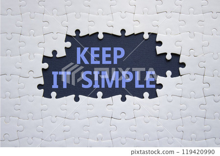 Keep it Simple symbol. Concept words Keep it Simple on white puzzle. Beautiful deep blue background. Business and Keep it Simple concept. Copy space. Keep it Simple symbol. Concept words Keep it Simple on white puzzle. Beautiful deep blue background. Business and Keep it Simple concept. Copy space. 119420990