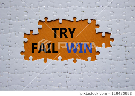 Try Fail Win symbol. Concept words Try Fail Win on white puzzle. Beautiful orange background. Business and Try Fail Win concept. Copy space. Try Fail Win symbol. Concept words Try Fail Win on white puzzle. Beautiful orange background. Business and Try Fail Win concept. Copy space. 119420998