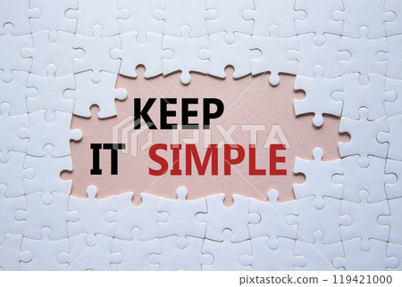 Keep it Simple symbol. Concept words Keep it Simple on white puzzle. Beautiful pink background. Business and Keep it Simple concept. Copy space. 119421000