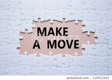 Make a Move symbol. Concept word Make a Move on white puzzle. Beautiful pink background. Business and Make a Move concept. Copy space 119421001