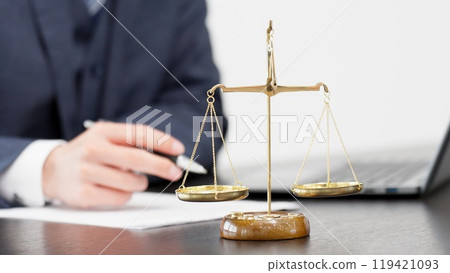 Hands of a businessman conducting a survey on a computer Hands of a businessman conducting a survey on a computer 119421093