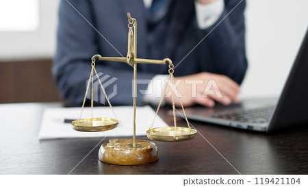 Hands of a businessman conducting a survey on a computer Hands of a businessman conducting a survey on a computer 119421104