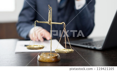 Hands of a businessman conducting a survey on a computer 119421105