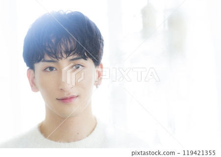 Man in white knit 119421355