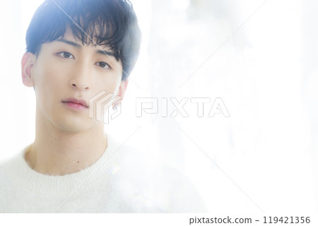 Man in white knit Man in white knit 119421356